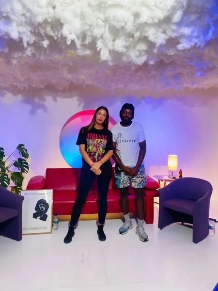 Beyond Black Identity podcast guest and host on set, host in a TRIYBE T-shirt